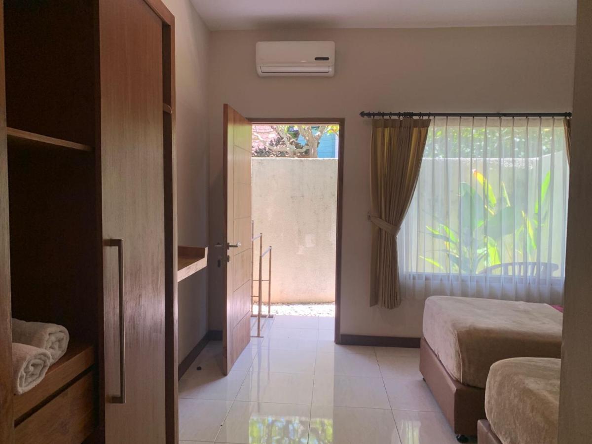 Kuta Suci Guesthouse Екстер'єр фото